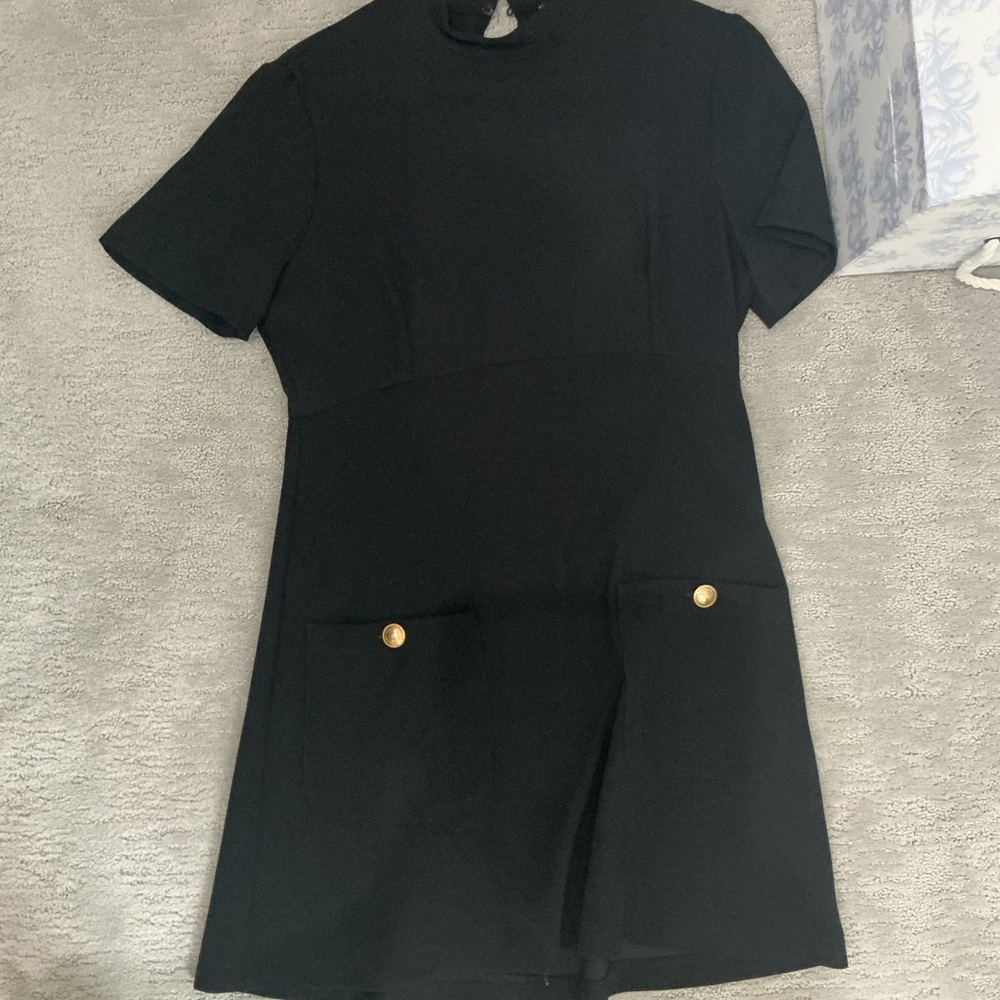 Elegant Black Dress with Gold Accents